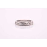 A Tiffany & Co. platinum half eternity ring, consisting of eleven square step-cut diamonds estimated