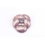 Georg Jensen - a pansy brooch, centred by a moonstone cabochon, No.113, silver import marks for