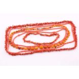 A coral bead two strand necklace, the yellow metal clasp stamped 14kt, the 5.5mm beads, 41cm long,