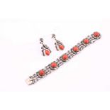A George Jensen coral bracelet and matching earrings. The bracelet consists of six round coral