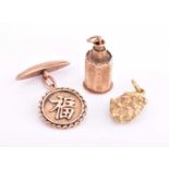 A nugget pendant, a yellow metal charm and a Chinese cufflink marked 14kt, 12.1 grams gross. (3)