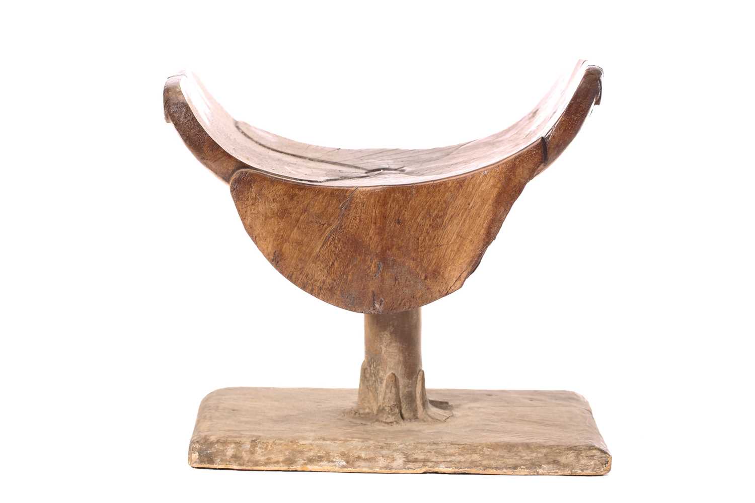 An Ashanti stool, Ghana, the dished top of carved petal form on a circular column with carved - Image 2 of 4