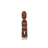 A Lega carved ivory standing female figure, Democratic Republic of Congo, the head and body with
