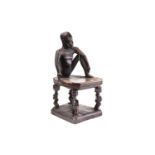 An unusual Tchokwe (Chokwe) chair, Angola, the backrest carved as a seated man with complete body