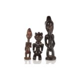 A Luba figure of a kneeling female, Democratic Republic of Congo, with stylised coiffure,