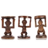 Three Songye carved hardwood caryatid stools, Democratic Republic of Congo, each in the Kalebwe