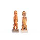 Two Lega ivory spirit figures, Democratic Republic of Congo, carved as a stylised male and female,