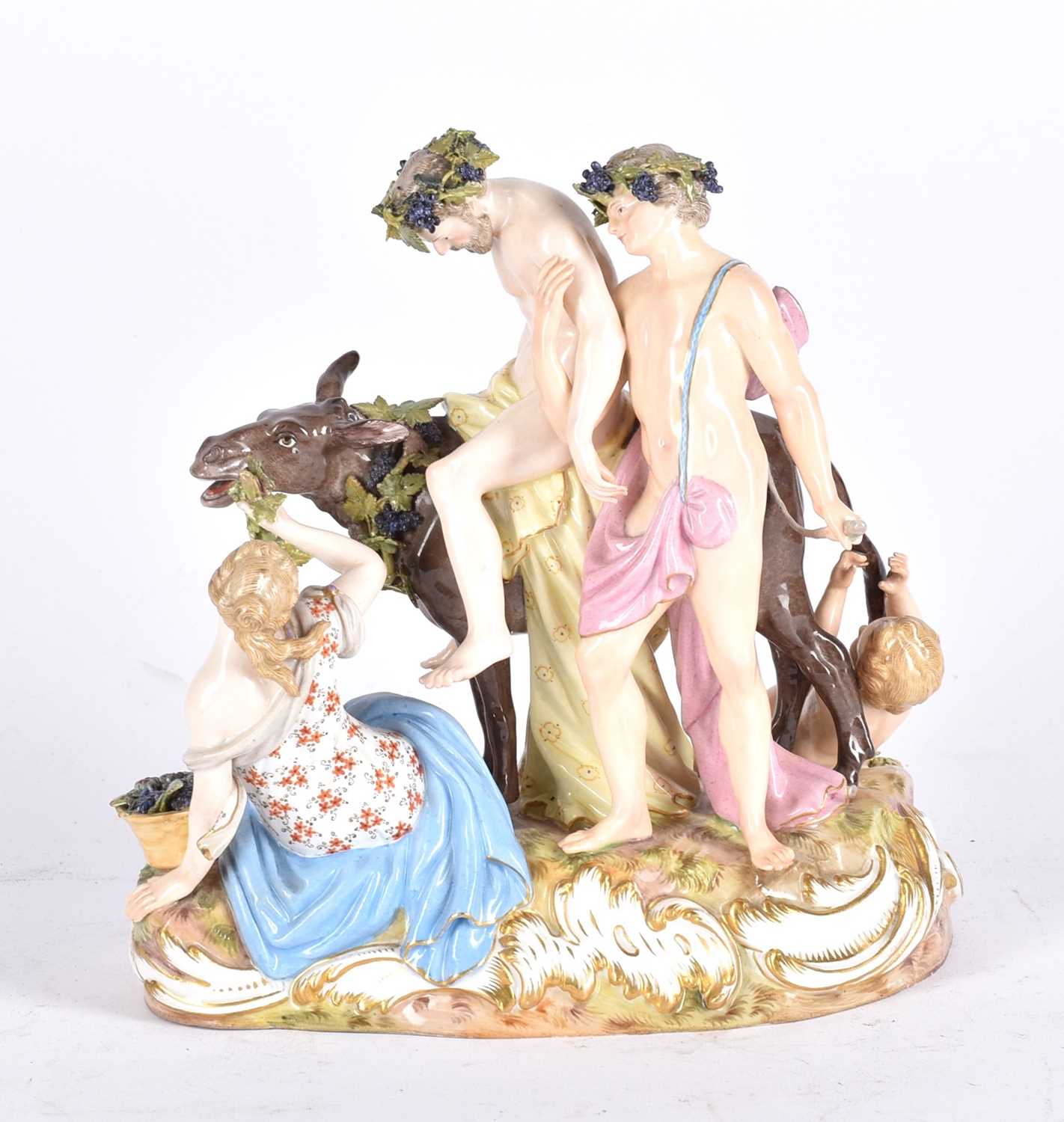 A Meissen porcelain figure group of the Drunken Silenus, 19th century, supported by Bacchus, a