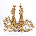 A pair of large French 19th century figural bronze candelabras, in the form of cherubs on a column