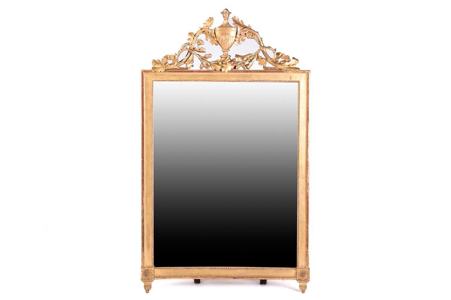 A late 18th century probably Italian carved wood and gilt gesso wall mirror with pierced oakleaf and