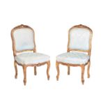 A pair of Louis XV style carved wood and gilt gesso side chairs, 20th century. with cartouch