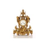 A late 19th century Samuel Marti et Cie 8-day ormolu mantle clock with flaming urn finial and