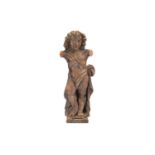 An 18th century Italian carved limewood cherub figure lacking arms, in standing pose and supported