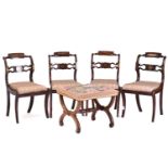 A set of four Regency brass inlaid mahogany side chairs with turned backrest and pierced and