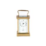 A large brass cased carriage clock, late 19th century, the enamel dial with roman numerals and