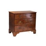 A Queen Anne walnut and oak chest of four long drawers With broad crossbanded top above drawer