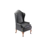 A George II style scroll arm wing back armchair, early 20th century, of small proportions, with
