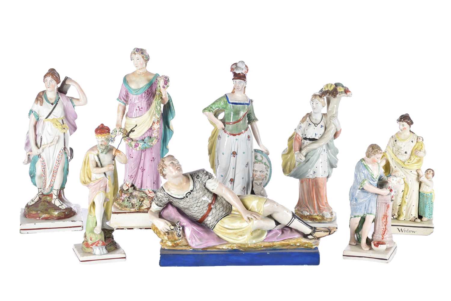 A collection of early 19th century Staffordshire pearlware figures, including an Enoch Wood figure