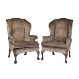 Two similar George II style wing back fireside armchairs, early 20th century, with mushroom coloured
