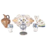 A collection of seven items of continental ceramics including a delftware vase, faience ware cat,