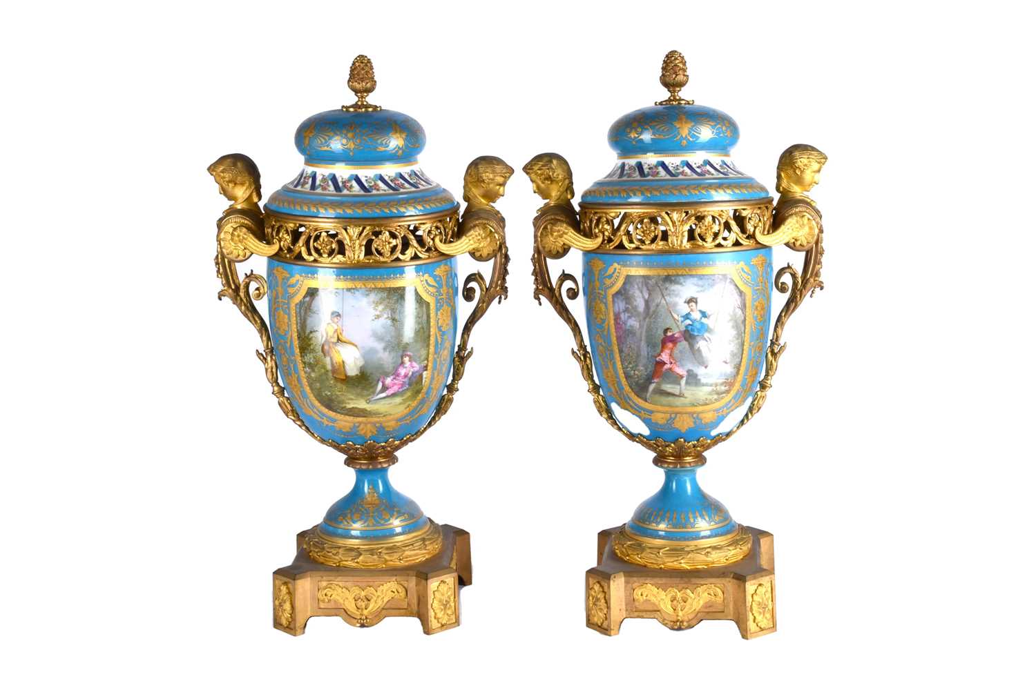 A large pair of Sevres ormolu mounted pedestal vases and covers, 19th century, the compressed bell