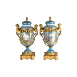 A large pair of Sevres ormolu mounted pedestal vases and covers, 19th century, the compressed bell