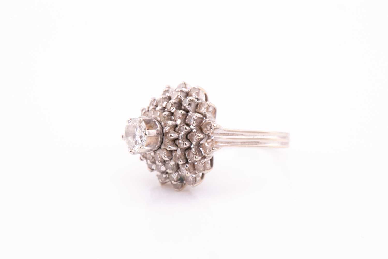 A diamond cluster dress ring; the four tiers of round brilliant cut diamonds in claw mounts and - Image 2 of 6