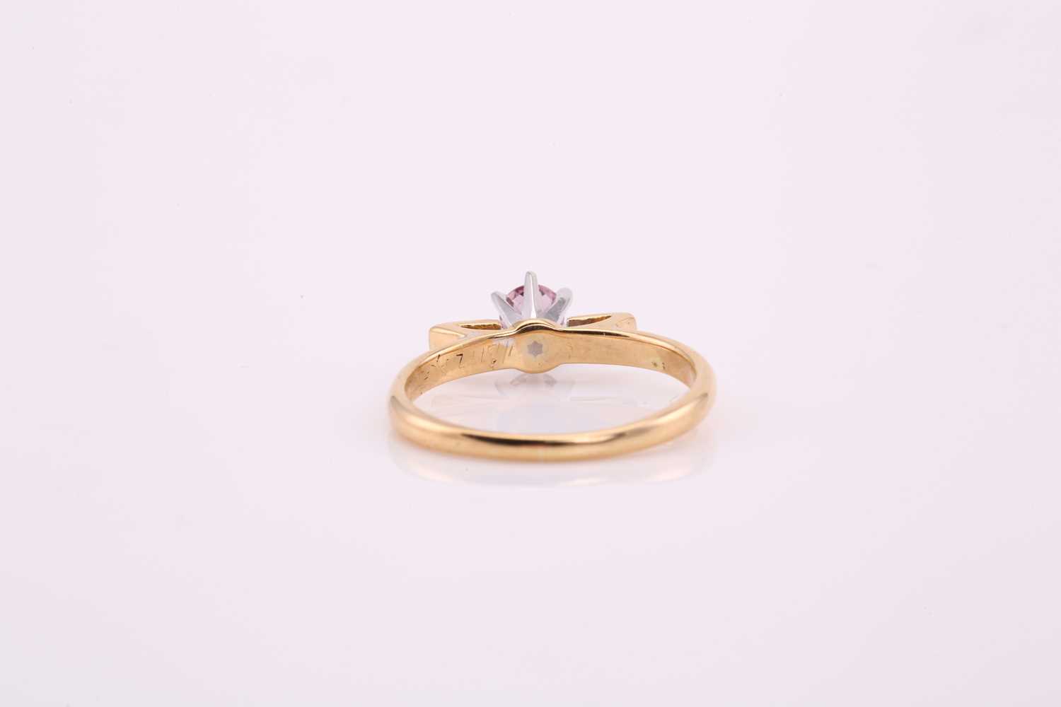 A pink sapphire solitaire ring, comprises a round pale pink sapphire approximately measuring 3.8 mm, - Image 2 of 4