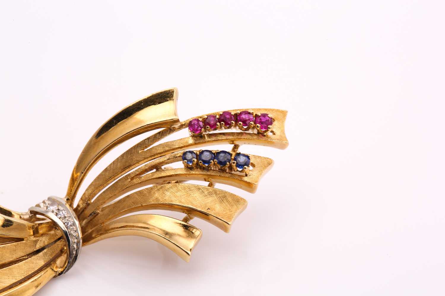 An 18ct bi-coloured gold bow brooch with gemstone accents, consisting of small round sapphires and - Image 3 of 5