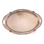 An early 20th-century heavy gauge silver two-handed oval tray. Sheffield 1932 by Walker & Hall. With