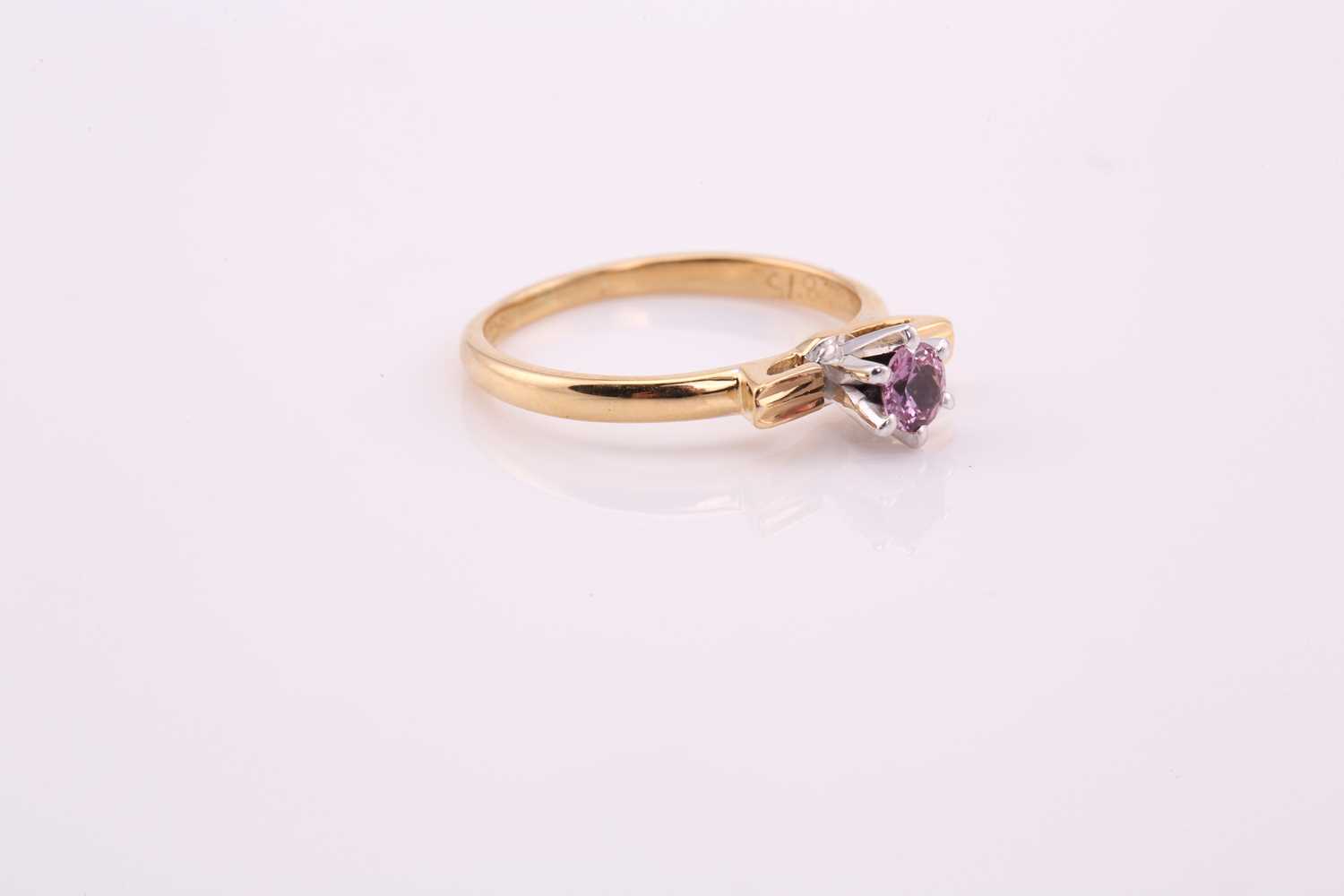 A pink sapphire solitaire ring, comprises a round pale pink sapphire approximately measuring 3.8 mm, - Image 3 of 4