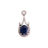 A sapphire and diamond pendant, consisting of an oval sapphire with deep blue body colour and