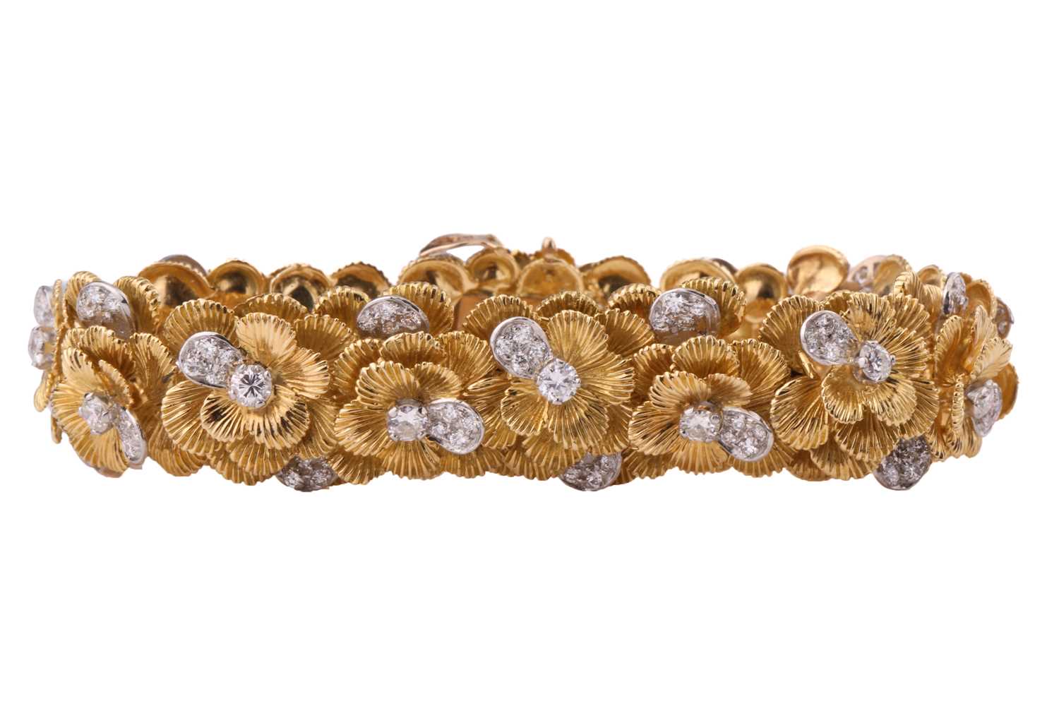 A Kutchinsky platinum and 18ct yellow gold diamond bracelet, comprises articulated links in form