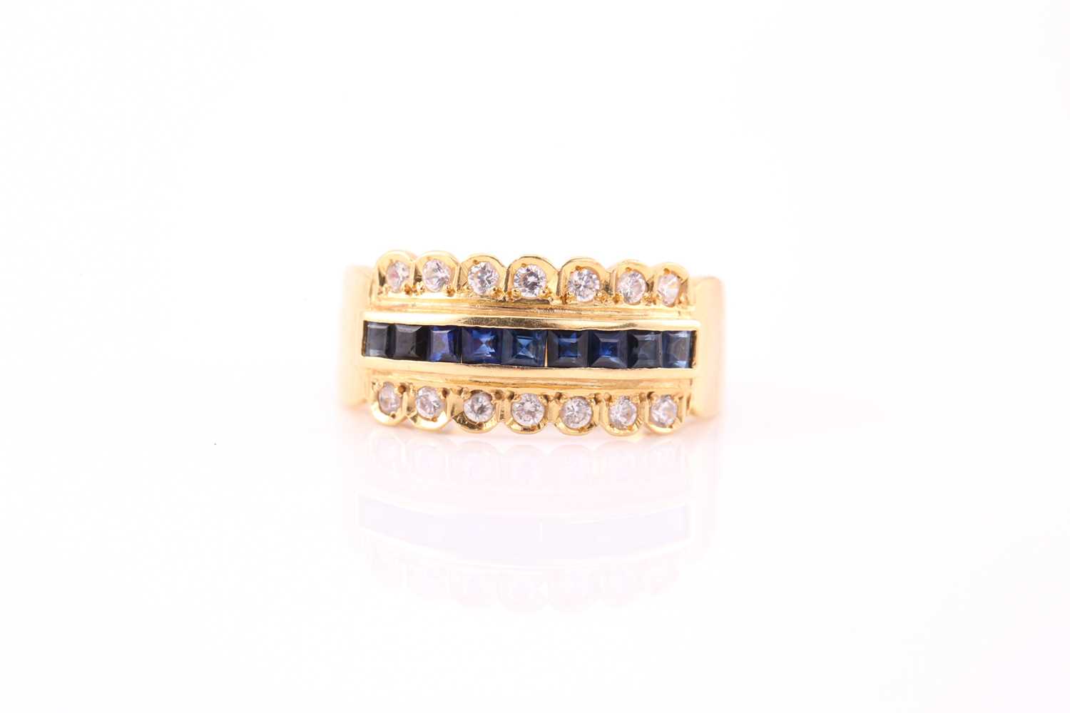 A yellow metal, diamond, and sapphire ring, channel-set to centre with a row of calibre-cut - Image 2 of 4