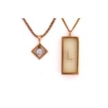 Two pendant necklaces, one consisting of 'floating' gemstones in a transparent rectangular prism