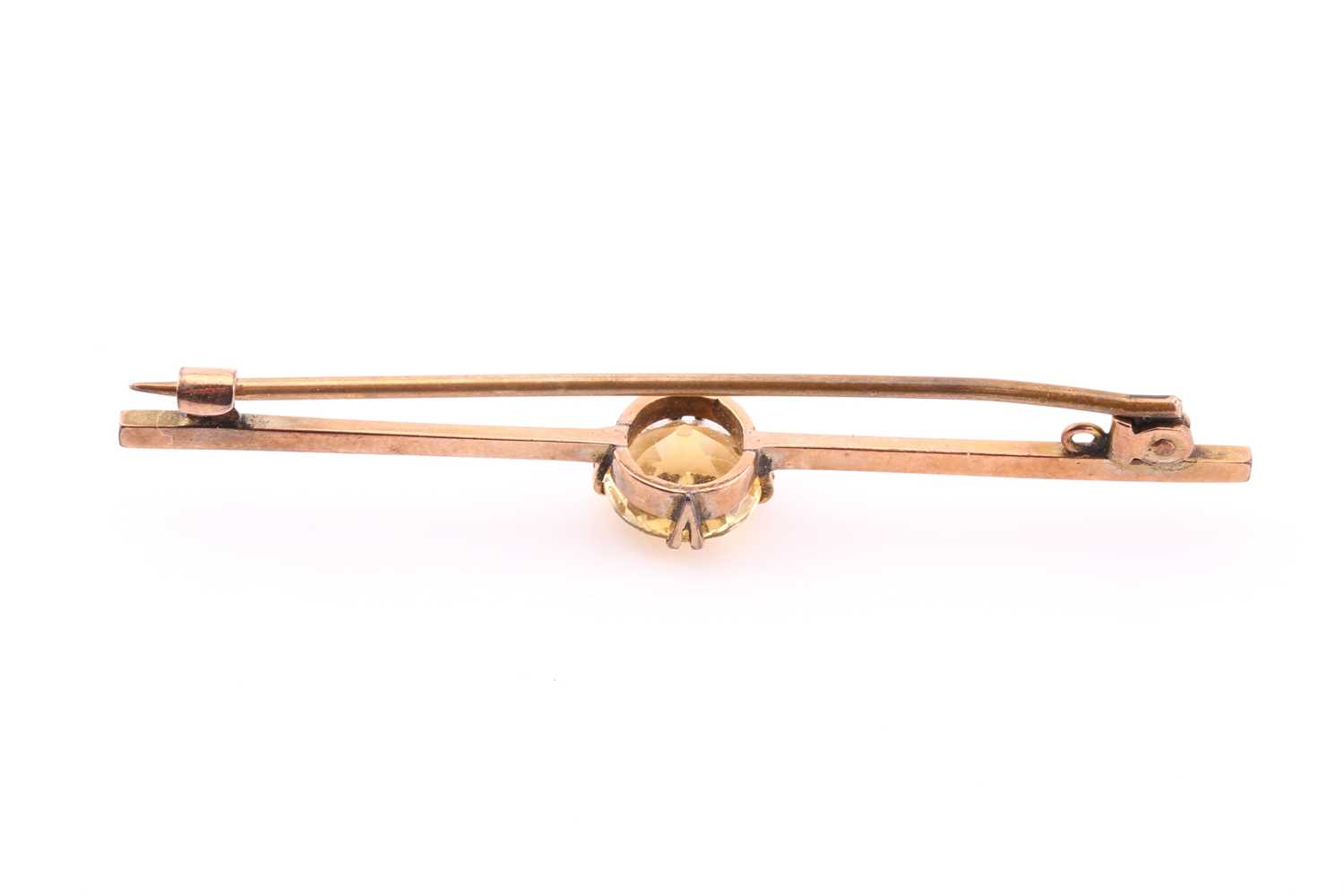 A yellow metal and citrine bar brooch, set with a mixed round-cut stone, approximately 8.7 mm - Image 2 of 2