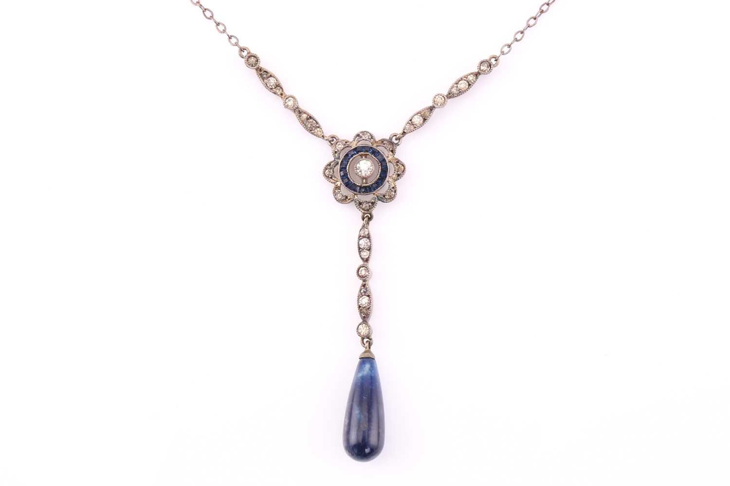 A silver drop necklace with blue and white stones, consisting of a target pendant and a sodalite