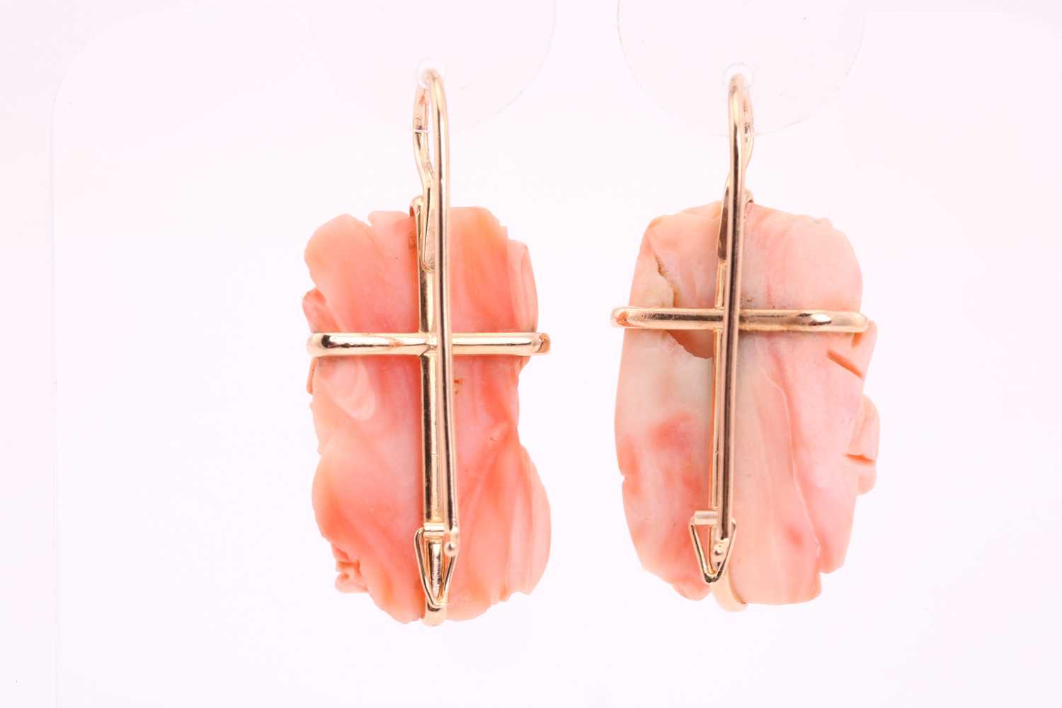 A pair of coral pendant earrings; the carved coral roses in yellow metal cruciform frame mounts to - Image 3 of 3