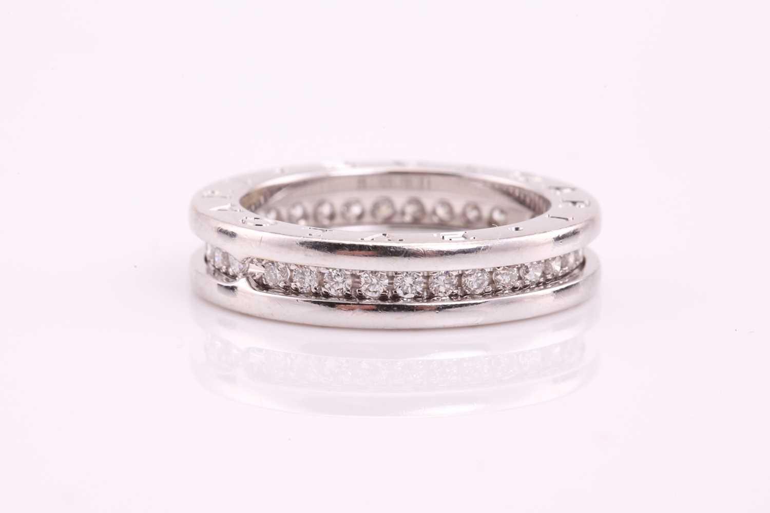 Bulgari. A full hoop Bulgari B Zero diamond ring; the central round brilliant cut diamond band - Image 8 of 13
