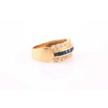 A yellow metal, diamond, and sapphire ring, channel-set to centre with a row of calibre-cut