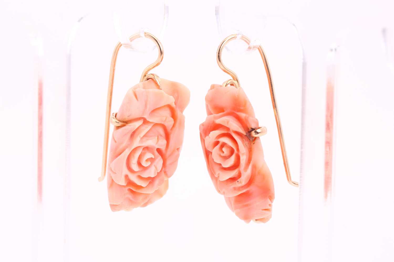 A pair of coral pendant earrings; the carved coral roses in yellow metal cruciform frame mounts to - Image 2 of 3