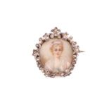 An Edwardian brooch, containing a glazed miniature of a lady, framed with a floral ornated white