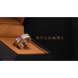 Bulgari. A full hoop Bulgari B Zero diamond ring; the central round brilliant cut diamond band