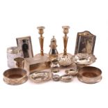 A small collection of silver items including: Pair of candlesticks, weighted bases, Birmingham 1980,