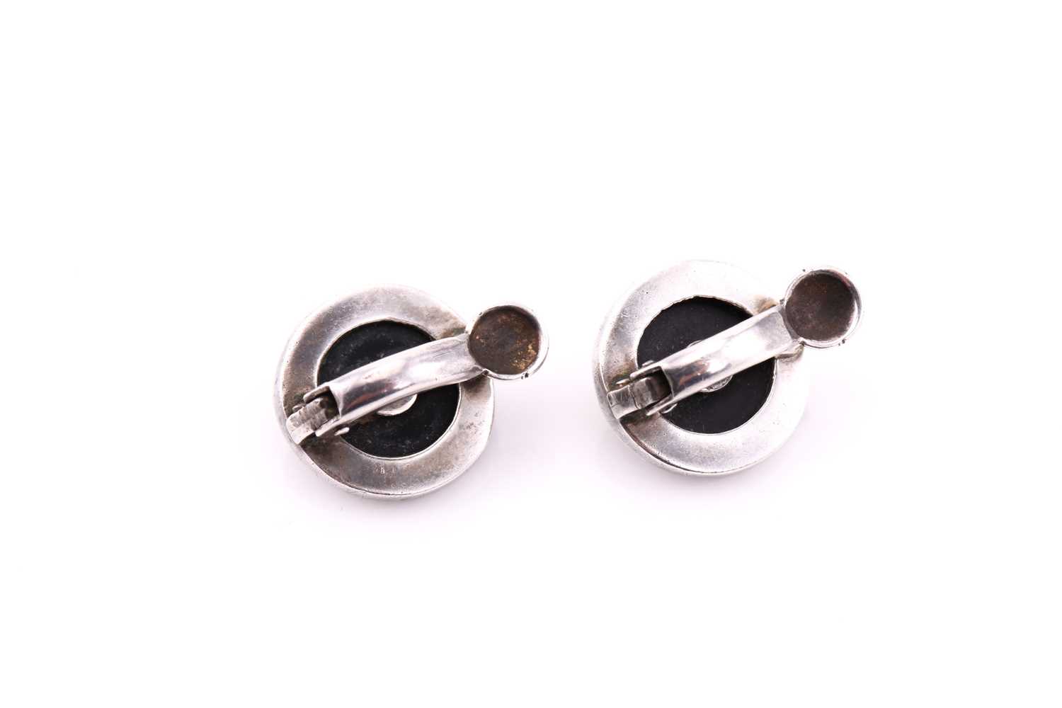 A pair of silver art deco ear clips, consisting of seed pearl highlight on an onyx panel, edged with - Image 2 of 2