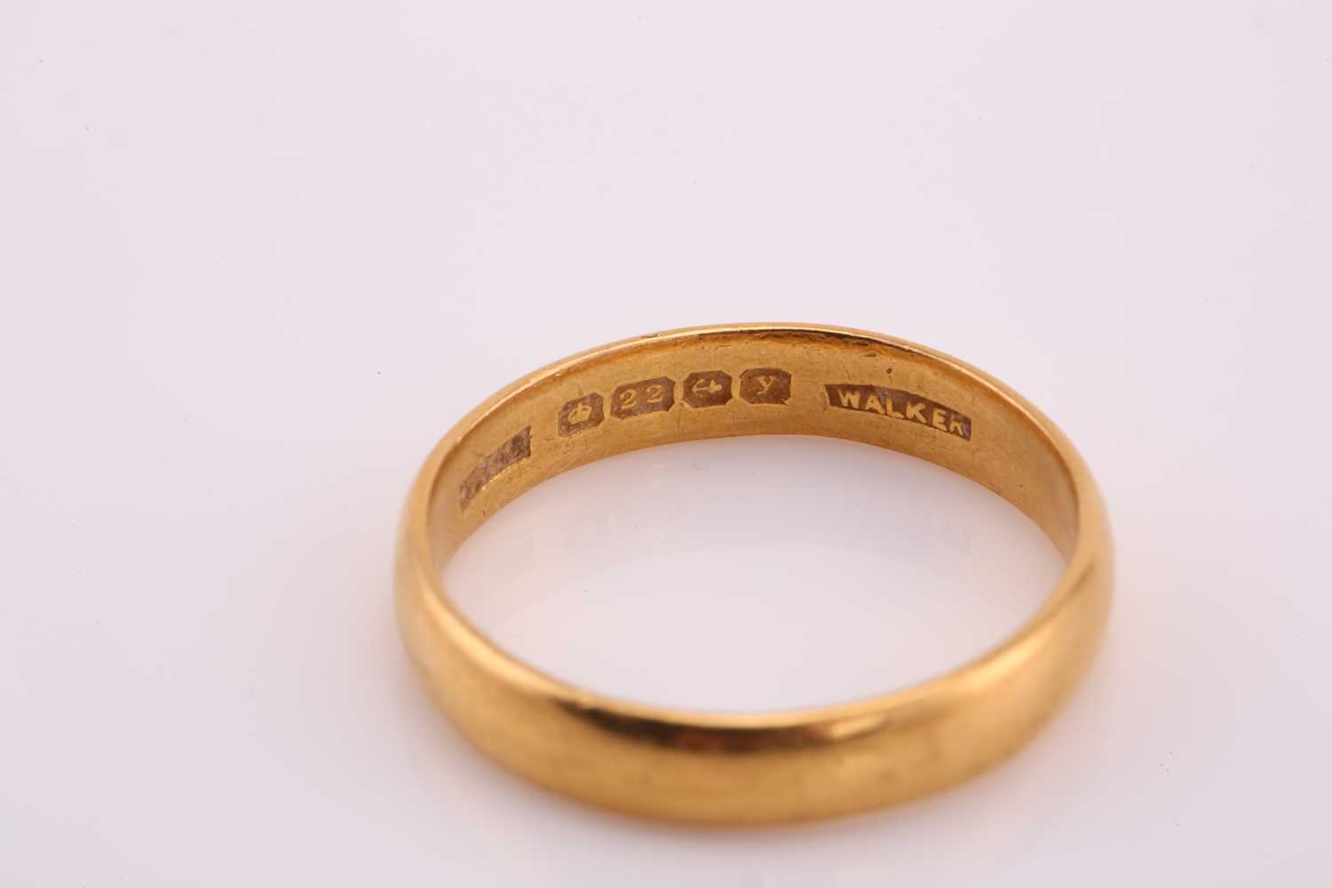 A 22ct yellow gold wedding band, comprises a plain D-section ring with Birmingham hallmarks and - Image 2 of 2