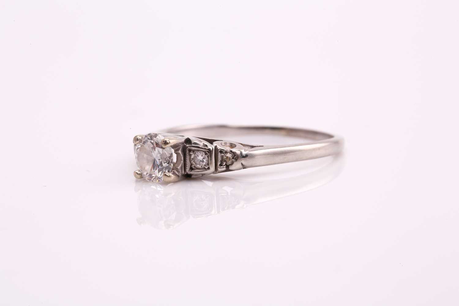 A diamond cathedral engagement ring, consisting of a round brilliant central diamond of 0.37cts, - Image 3 of 7