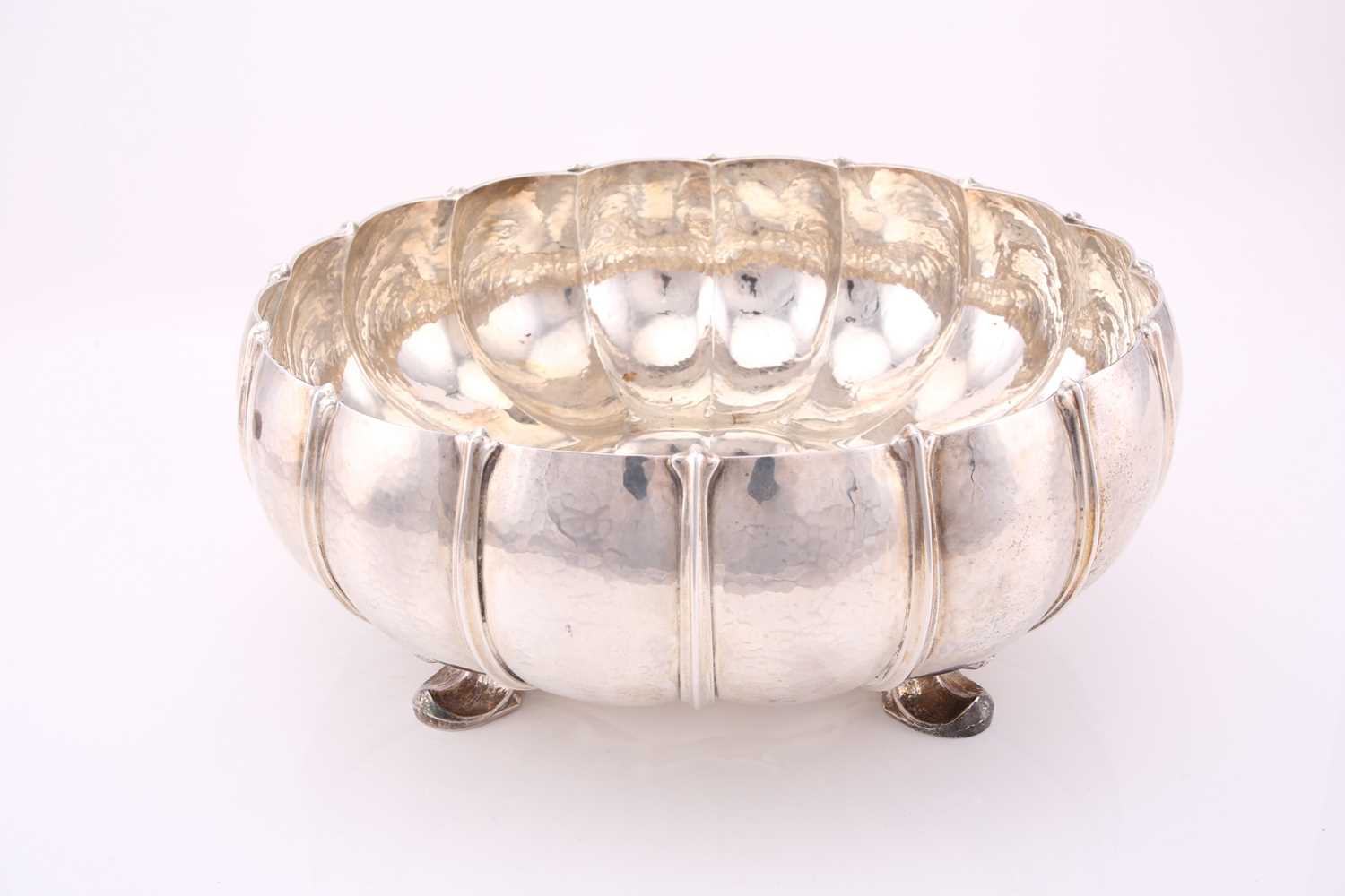 Omar Ramsden. A large Arts and Crafts silver bowl; London 1934; the circular melon fluted, spot