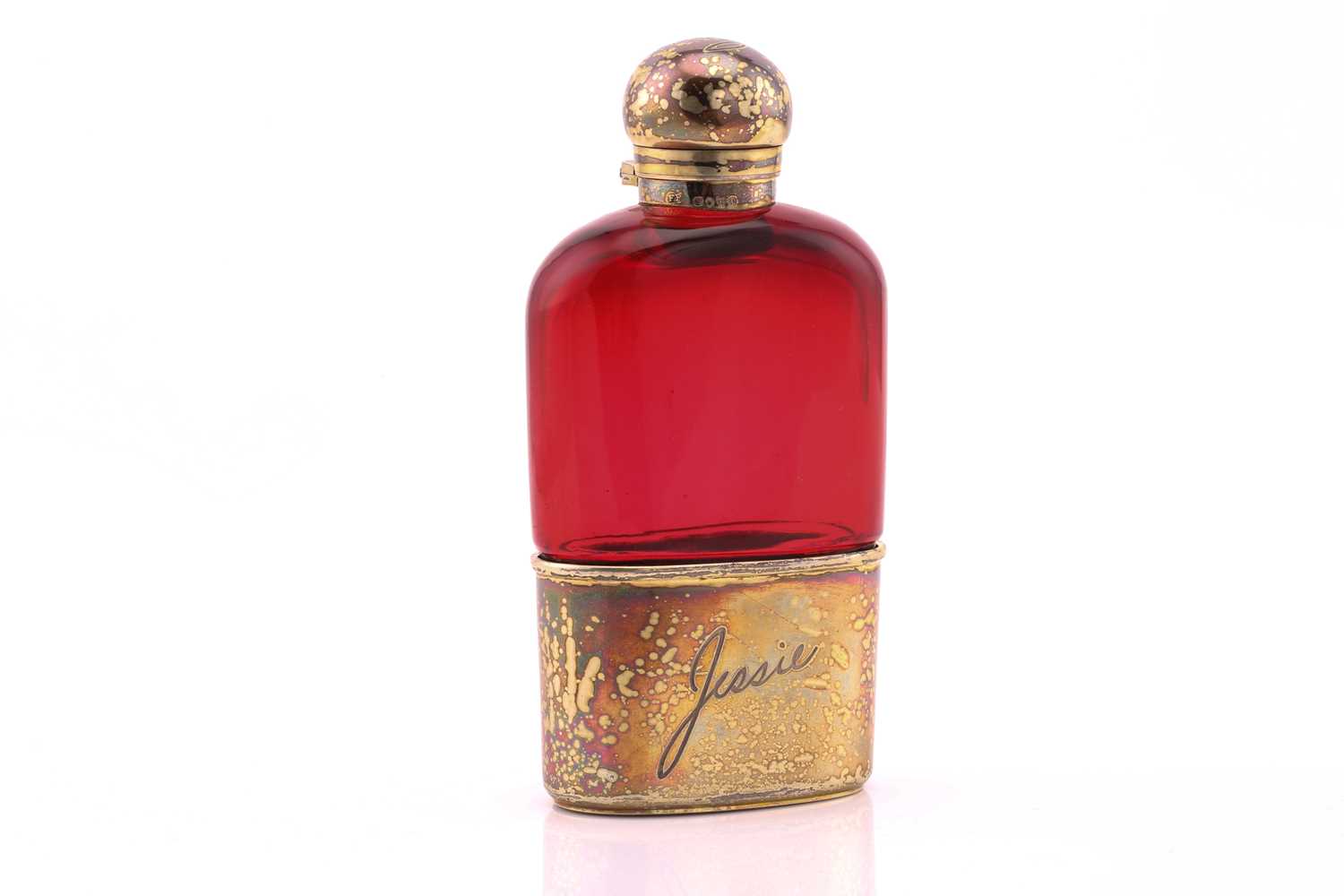 A Victorian silver gilt and ruby flash glass hip flask; pull-off beaker and bayonet cover