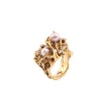 A Mid-century pearl and diamond cocktail ring, consisting of two baroque pearls with purplish tones,